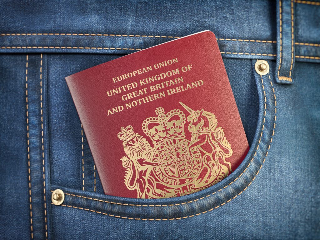 UK United Kingdom passport in pocket jeans